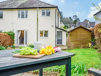 a bunch of grapes on a table in a yard at 3 Bed in Keswick oc-84638 in Keswick