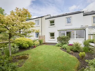 an exterior view of a house with a garden at 2 Bed in Keswick oc-sz188 in Keswick