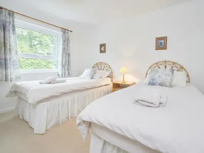 two beds in a room with a window at 2 Bed in Keswick oc-sz188 in Keswick