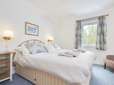 a bedroom with a large bed with towels on it at 2 Bed in Keswick oc-sz188 in Keswick