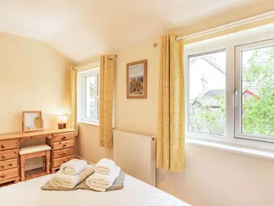 a bedroom with a bed and a window at 3 Bed in Keswick oc-sz335 in Portinscale