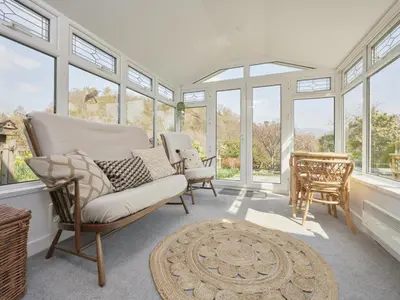 a living room with a lot of windows at 3 Bed in Keswick oc-sz533 in Braithwaite