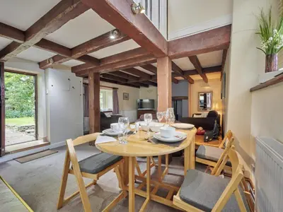 a living room with a wooden table and chairs at 2 Bed in Cockermouth oc-sz588 in Buttermere