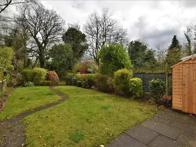 a garden with a lawn and a fence at 2 Bed in Keswick oc-87092 in Keswick