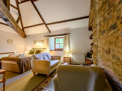 a living room with a bed and a couch at 1 Bed in Penrith oc-88201 in Mosedale