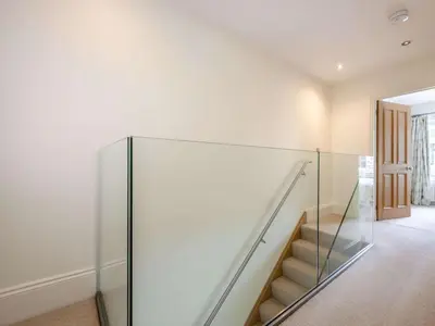 a staircase in a house with a glass wall at 2 Bed in Keswick oc-89257 in Keswick