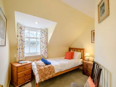 a bedroom with a bed and a window at 4 Bed in AYR 90038 in Ayr