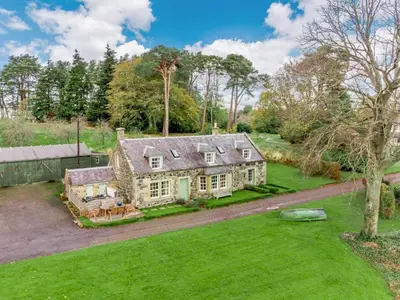 an aerial view of a house with a yard at 4 Bed in AYR 90038 in Ayr