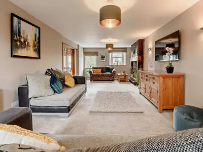 a living room with a couch and a table at 3 Bed in Egremont oc-90050 in Hale