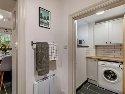 a kitchen with a washer and dryer in a room at 2 Bed in Keswick oc-90064 in Threlkeld