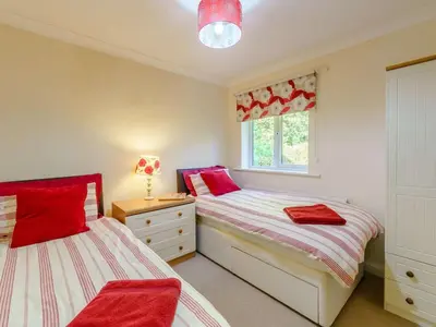 two beds in a bedroom with red and white at 3 Bed in Keswick oc-90266 in Applethwaite