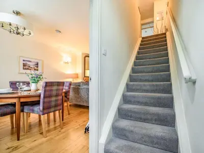 a staircase in a house with a table and chairs at 2 Bed in Keswick oc-sz427 in Keswick