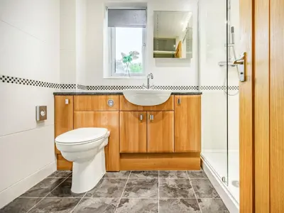 a bathroom with a toilet and a sink and a shower at 2 Bed in Keswick oc-sz427 in Keswick