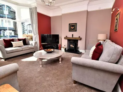 a living room with two couches and a coffee table at 6 Bed in Keswick oc-90333 in Keswick
