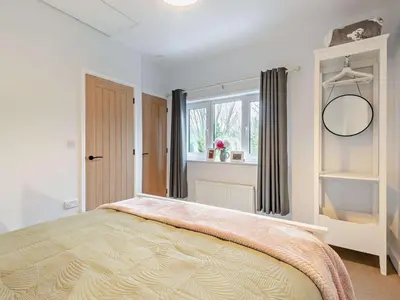 a bedroom with a large bed and a window at 2 Bed in Dearham 91132 in Dearham