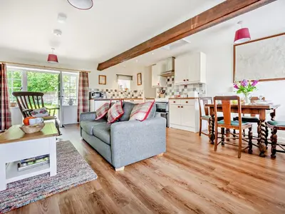 a living room with a couch and a table at 1 Bed in Mosedale 91232 in Mosedale