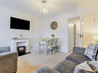 a living room with a couch and a table at 2 Bed in Keswick 91901 in Keswick