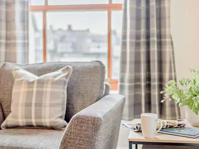 a living room with a couch and a coffee table at 2 Bed in Keswick 91901 in Keswick