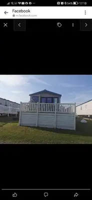 a picture of a fence with a house behind it at Birds Eye View in Mainsriddle