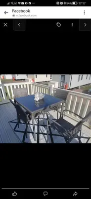 a blue table and two chairs on a deck at Birds Eye View in Mainsriddle