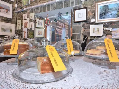 a display of different types of pastries on a table at 2 Bed in Keswick 28377 in Braithwaite