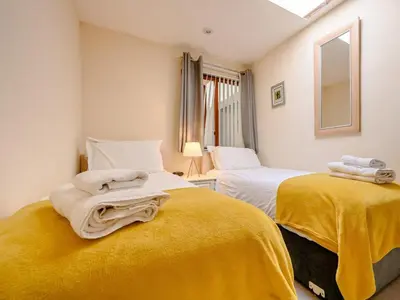 two beds in a room with towels on them at 2 Bed in Keswick 28377 in Braithwaite