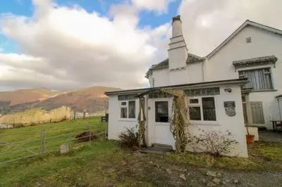 an old white house with a steeple at Grasmere View, stunning views over Grasmere Lake, ideal romantic break in Grasmere