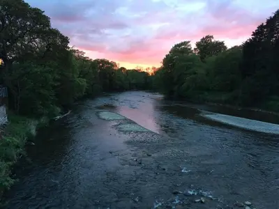 a view of a river at sunset at 1 Bed in Cockermouth oc-93147 in Cockermouth