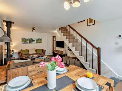 a kitchen and living room with a table and a couch at 2 Bed in Ambleside oc-sz500 in Grasmere