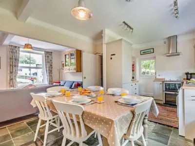 a kitchen and dining room with a table and chairs at 3 Bed in Chapel Stile SZ161 in Chapel Stile
