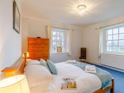 a bedroom with a large white bed with pillows at 4 Bed in Cockermouth oc-85979 in Buttermere