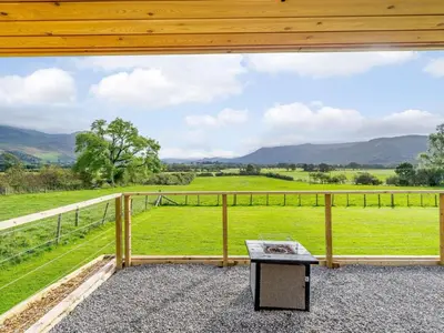 a view of a field from the balcony of a house at 1 Bed in Keswick oc-82476 in Bassenthwaite