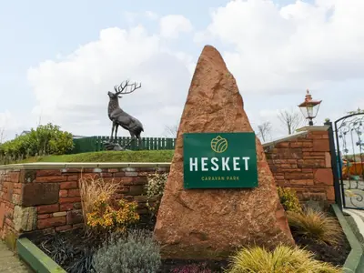 a sign for heist garden centre with a deer statue in the background at A and C Lodge-Plot 21 in Carlisle