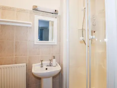 a bathroom with a sink and a shower at Walla Crag, Royal Oak House in Keswick