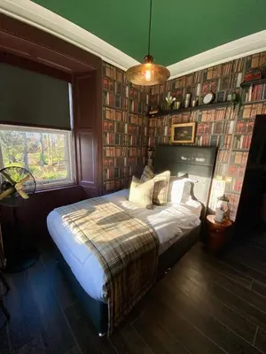 a bedroom with a bed in a room at Abbotsford Hotel in Ayr