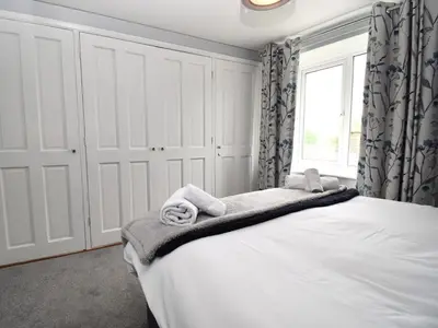 a bedroom with a bed with towels on it at 1 Bed in Keswick SZ468 in Keswick