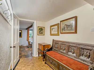 a bedroom with a wooden bed in a room at 4 Bed in Holmrook oc-sz158 in Eskdale