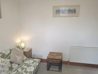 a living room with a couch and a table at Luxury 1BR Flat Central Dumfries Self Check-in, Parking, Wi-Fi in Dumfries