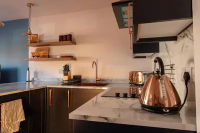 a kitchen with a tea kettle on a counter at The Bradan - Troon - Coorie Doon Stays in Troon