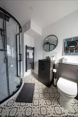 a bathroom with a shower and a toilet and a sink at The Bradan - Troon - Coorie Doon Stays in Troon