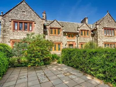 an old stone house with a pathway in front of it at 2 Bed in Holmrook oc-sz403 in Santon Bridge
