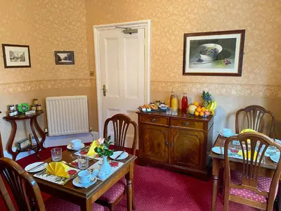 a dining room with a table and chairs and a table and chairsktop at Number 10 Bed & Breakfast in Keswick