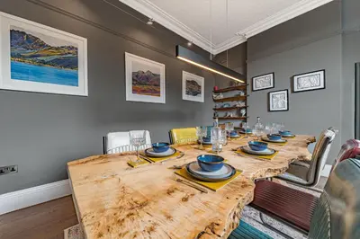 a dining room with a wooden table and chairs at The Eyrie in Keswick