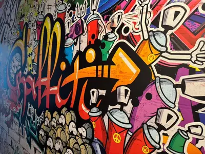 a wall covered in graffiti with a painting on it at Quayside Apartment -2 Bedrooms - Sleeps 4 in Whitehaven