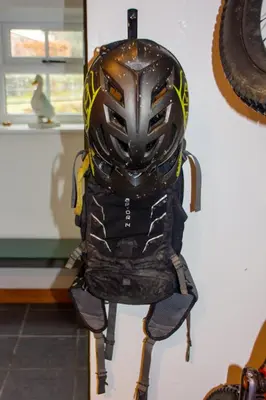 a motorcycle helmet hanging on a wall at Cottage On The Brook in Braithwaite