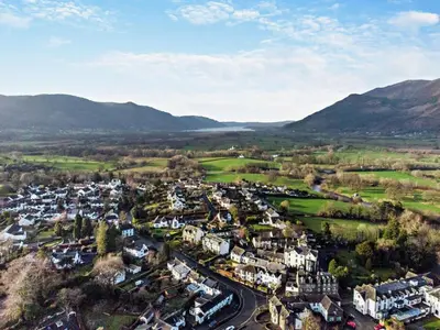 an aerial view of a small town in the mountains at 3 Bed in Portinscale 93949 in Portinscale