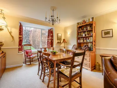 a dining room with a table and chairs at 3 Bed in Portinscale 93949 in Portinscale