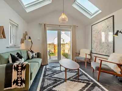 a living room with a couch and a table at 3 Bed in Loweswater 94152 in Arlecdon