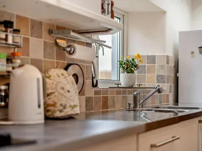 a kitchen counter with a sink and a window at 3 Bed in Keswick oc-94346 in Threlkeld