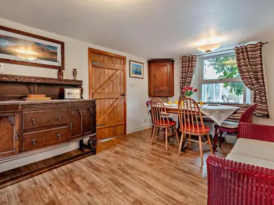 a dining room with a wooden table and chairs at 3 Bed in Keswick oc-94346 in Threlkeld